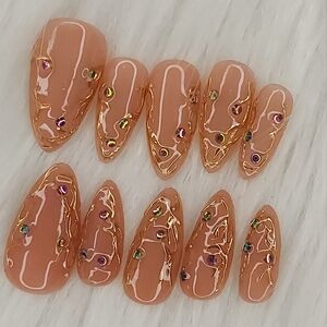 Medium Length Gold Chrome Crystal Nails